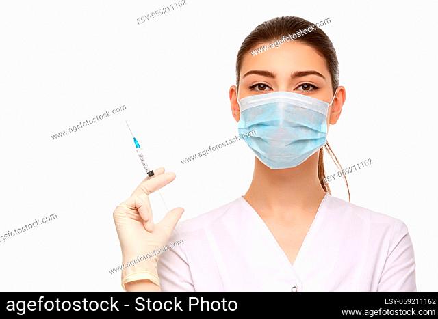 beautiful woman doctor in medical robe holding syringe isolated on white background. copy space