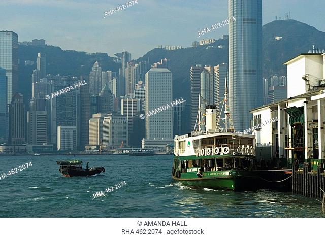 Small fishing boat and Star Ferry, Victoria Harbour, Hong Kong, China, Asia