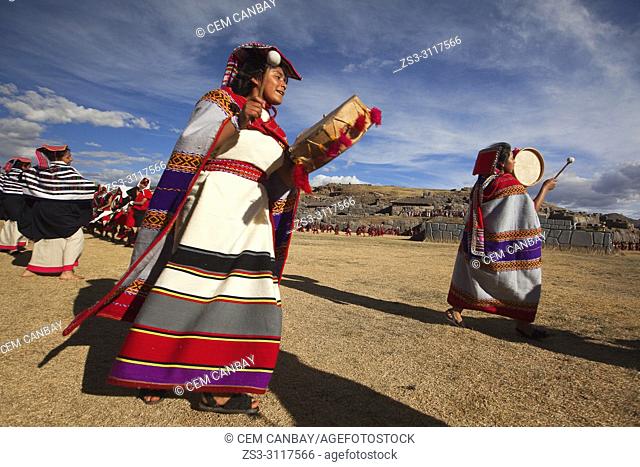 Indigenous people with traditional costumes during a performance at the Inti Raymi Festival in Saqsaywaman Archaeological Site, Cusco, Peru, South America
