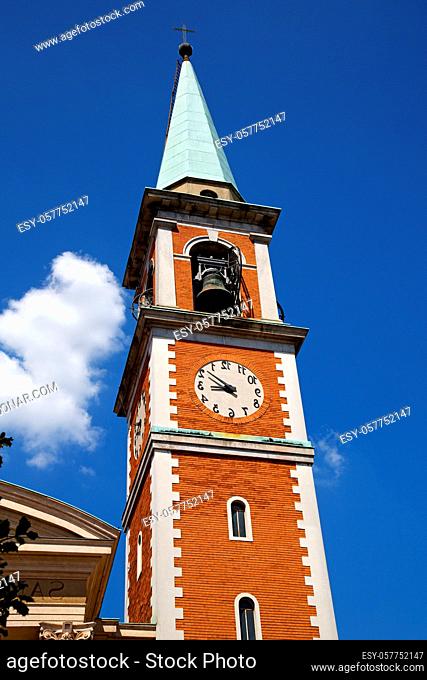 church  olgiate olona  italy the old wall terrace church window clock and bell tower
