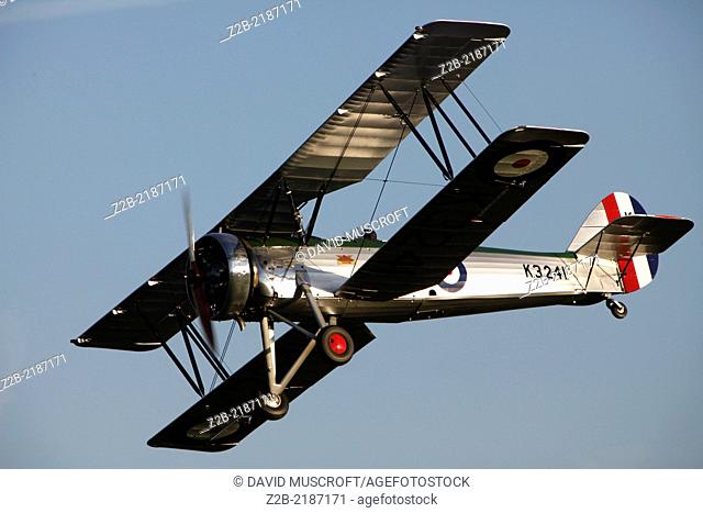 1930's RAF Avro Tutor pilot training biplane aircraft at a Shuttleworth Collection air display at Old Warden airfield, Bedfordshire, UK