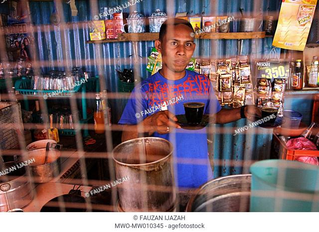 A coffee maker at a coffee shop in Lamno, Aceh Jaya, Indonesia July 1, 2007