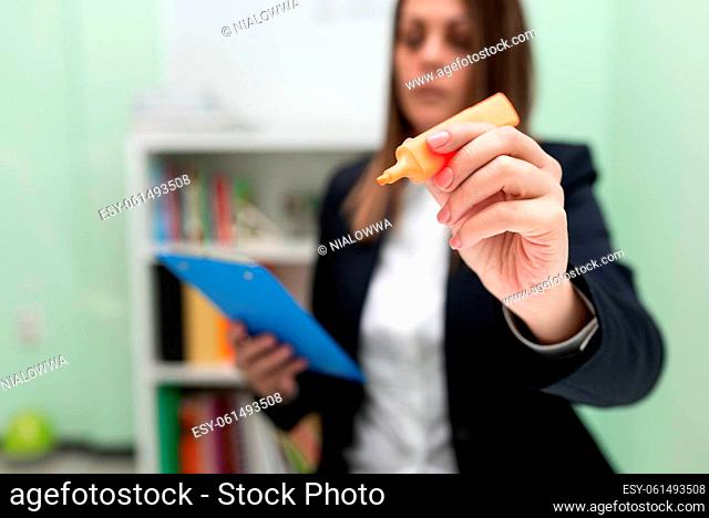 Woman Holding Clipboard In One Hand And Marker With Other Pointing New Idea