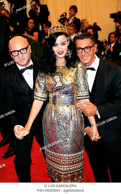Singer Katy Perry and designers Domenico Dolce and Stefano Gabbana (r) arrive at the Costume Institute Gala for the ""Punk: Chaos to Couture"" exhibition at the...