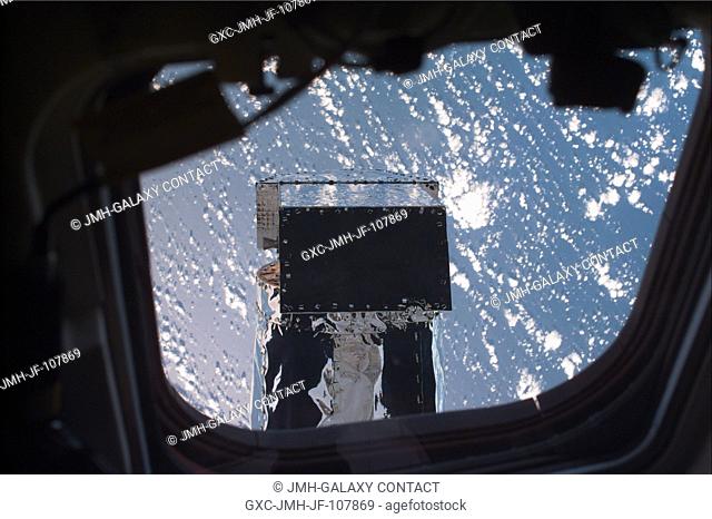 An electronic still camera (ESC) aimed through Columbia's aft flight deck windows recorded this scene of a portion of the Chandra X-Ray Observatory during...
