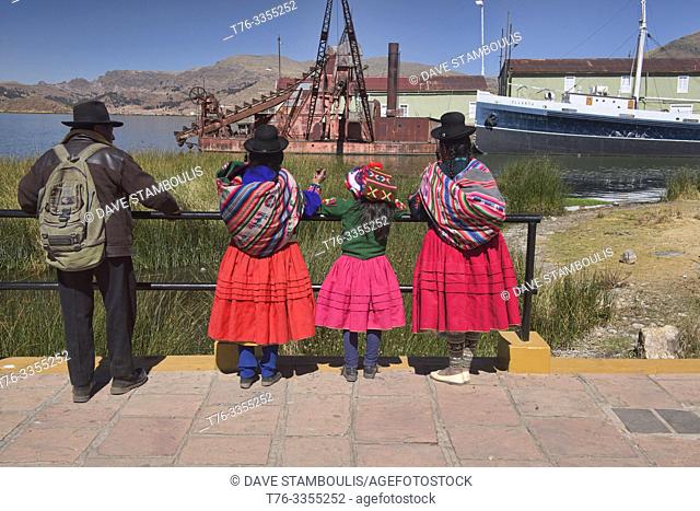 Islanders in traditional dress, Lake Titicaca, Puno, Peru