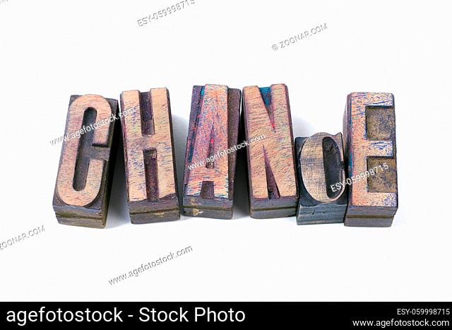 chance word made from scattered wooden letterpress type isolated on white