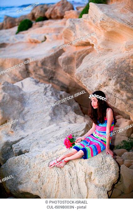 Girl resting on rocks
