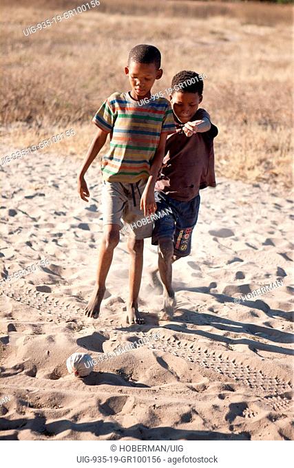 Trditional bushmen boys playing in Namiba
