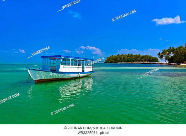 Tropical island and boat - nature travel background