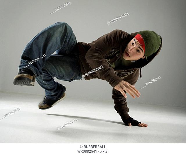 Young man break dancing