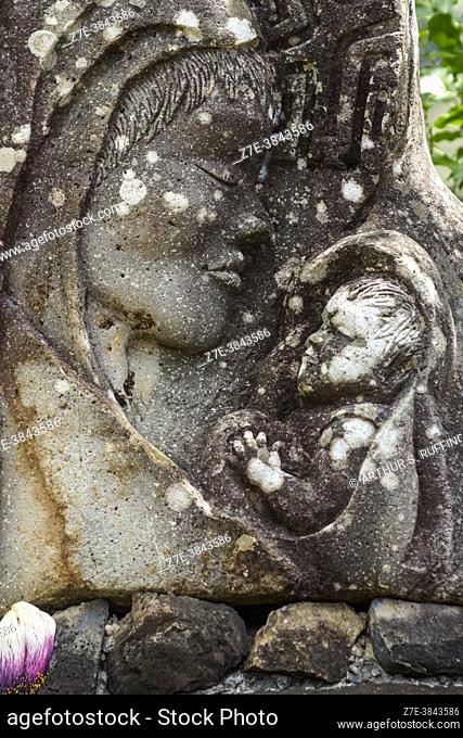 Stone sculpture of Madonna and Child. Notre Dame Cathedral of Taiohae (Cathédrale Notre-Dame de Taiohae) complex. Taiohae, Nuku Hiva, Marquesas Islands