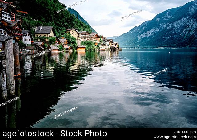 Scenic view of lakeside of Hallstatt in Austria with reflections on water
