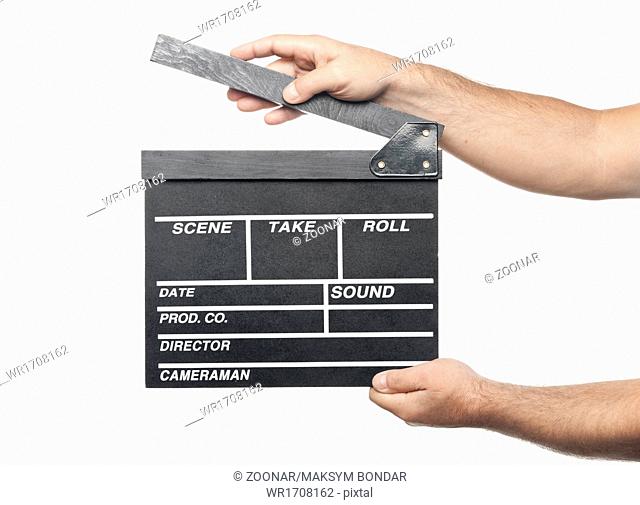 two male hands holding movie production clapper