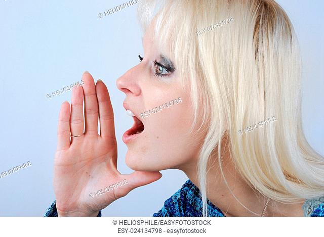 Young blonde woman with a cry