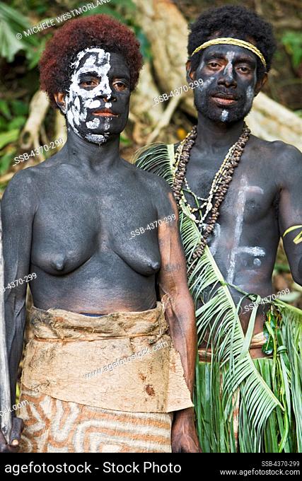 A New Guiean couple at a cultural presentation by participating tribes in Tufi, Papua New Guinea.  Participating clans were Fighoya, Kandoro, Tewari, Gaboru