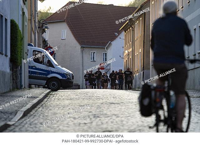 21 April 2018, Germany, Ostritz: Police secure a street at a 'Festival of Peace' countering a neo-Nazi festival nearby. Photo: Nils Holgerson/dpa