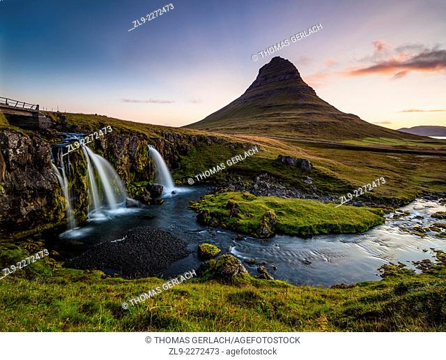 Kirkjufell mountain and waterfall Snaefelness Peninsula dramatic sunset prime tourist destination Iceland