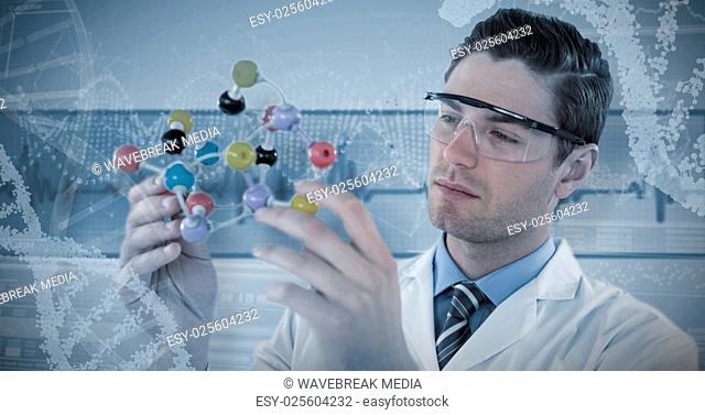 Composite image of scientist experimenting molecule structure