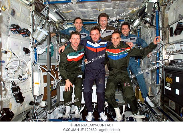 The Expedition Four and Soyuz 4 Taxi crews pose for a group photo in the Destiny laboratory on the International Space Station (ISS)