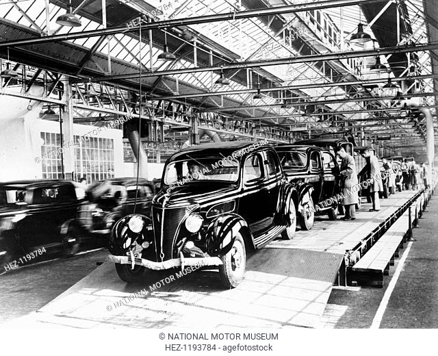 Ford factory, Dagenham, Essex, 1937. 22 hp Ford V8 Saloons being driven off the production line. When production began at the site in 1931