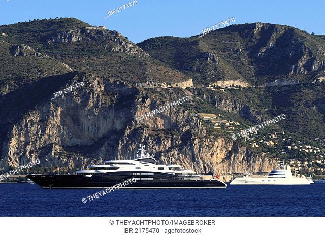 Motoryacht Serene, 133.9m, built in 2011 by yacht builder Fincantieri Yachts and owned by Yuri Scheffler, and motoryacht A on the Côte d'Azur, Eze at back