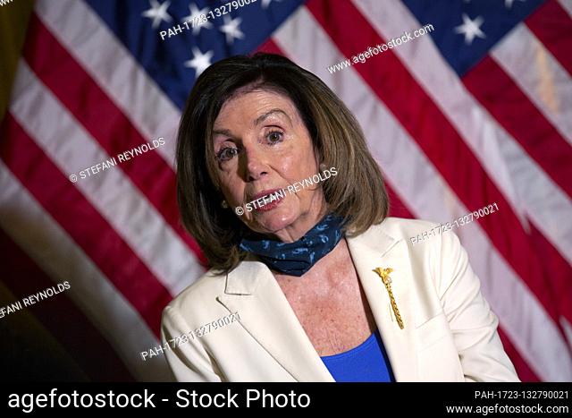 Speaker of the United States House of Representatives Nancy Pelosi (Democrat of California) speaks while holding the Bible following a bill enrollment ceremony...
