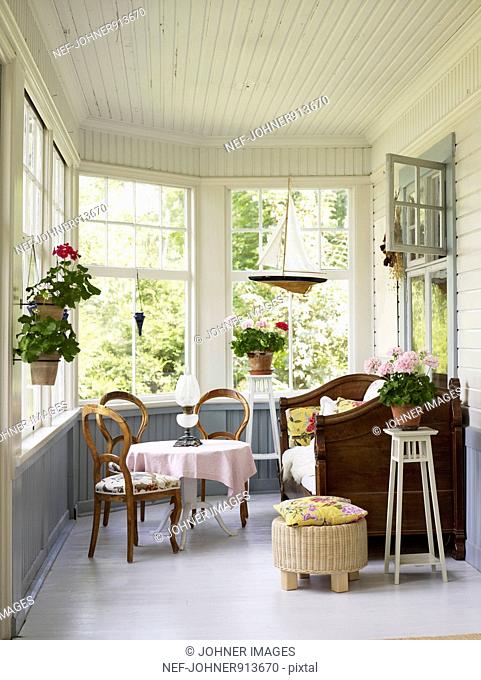 A glass-enclosed veranda, Sweden