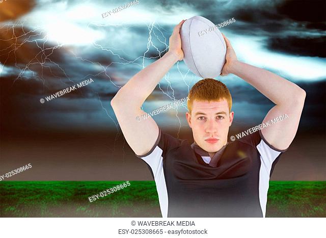 Composite image of rugby player about to throw a rugby ball 3D