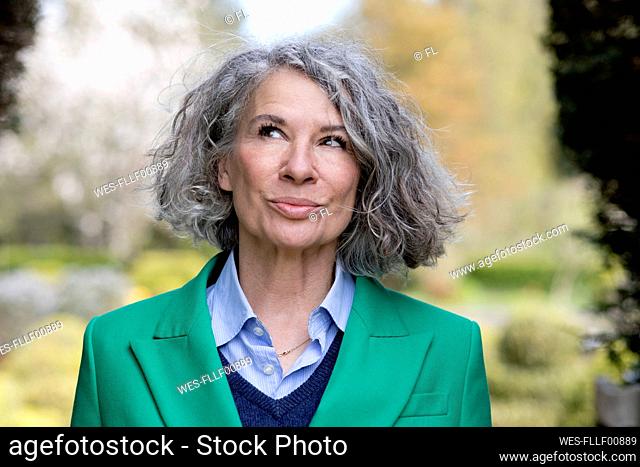 Thoughtful senior woman with gray hair