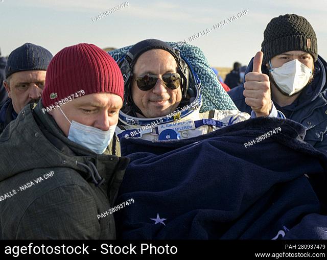 Expedition 66 Russian cosmonaut Anton Shkaplerov is carried to a medical tent shortly after he and fellow crew mates Mark Vande Hei of NASA and Pyotr Dubrov of...