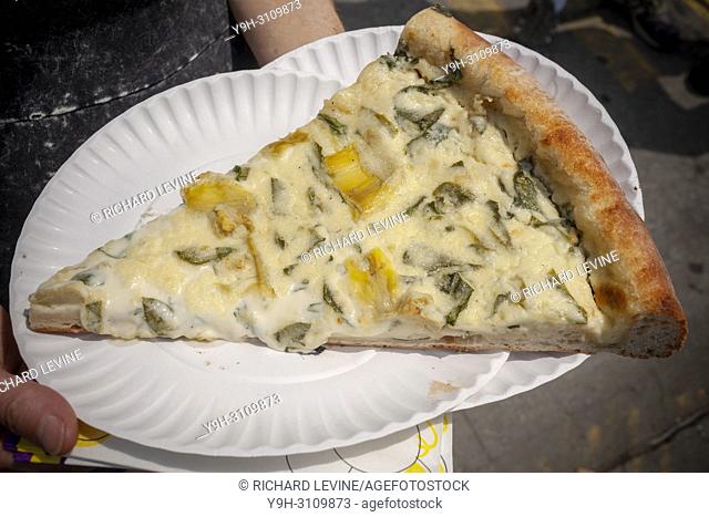 A slice of pizza from the popular Artichoke Basille's Pizza's newly opened outpost in the Bushwick neighborhood of Brooklyn in New York on Saturday, June 2
