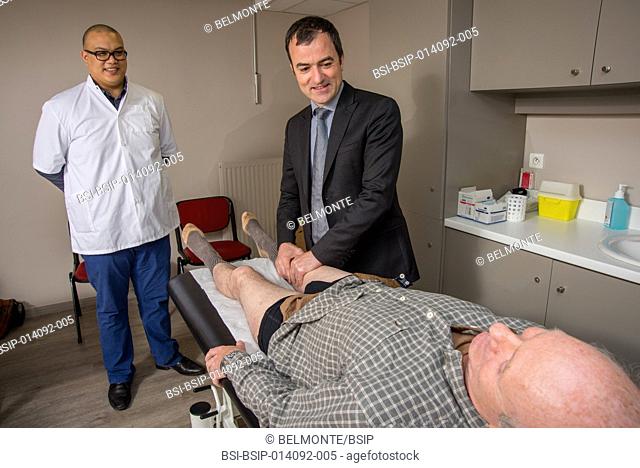Reportage in Nollet Clinic in Paris, France. Post-op consultation (hip replacement) with Dr Nogier, a hip surgeon. A 5th-year student in chiropractics attends