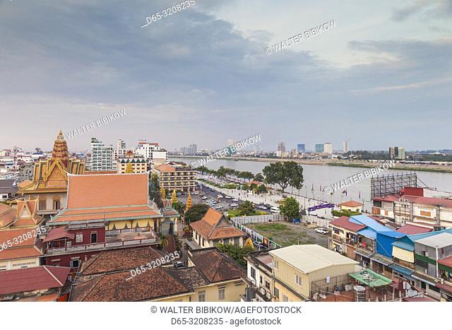 Cambodia, Phnom Penh, elevated skyine along Tonle Sap River, dusk