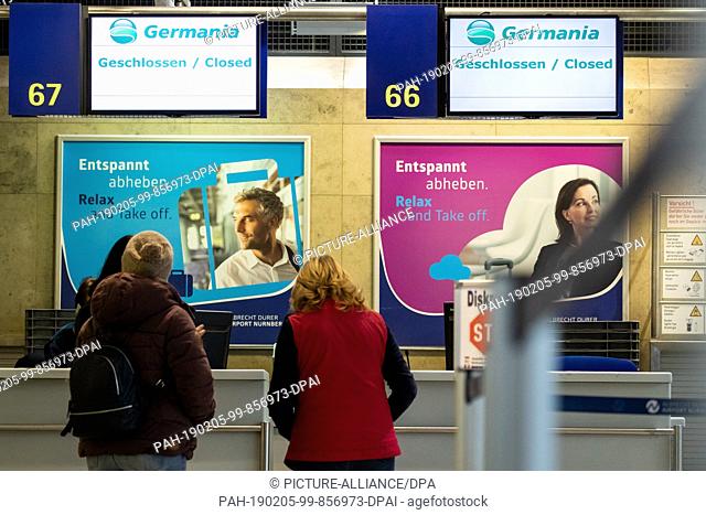 05 February 2019, Bavaria, Nürnberg: ""Closed"" is written on displays at check-in counters of the airline Germania at Albrecht Dürer Airport