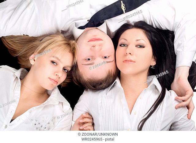 Portrait if the young man and two beautiful girls