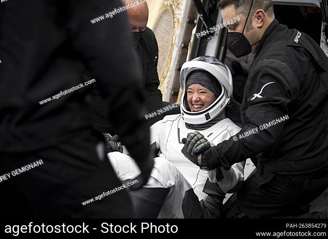 NASA astronaut Megan McArthur is helped out of the SpaceX Crew Dragon Endeavour spacecraft onboard the SpaceX GO Navigator recovery ship after she and NASA...