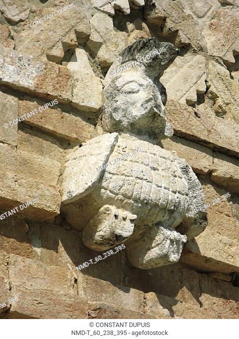 Low angle view of a sculpture on a stone wall, Nunnery Quadrangle, Uxmal, Yucatan, Mexico