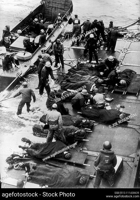 Wounded Marines Moved From Iwo Jima -- Marines, wounded in the bitter fighting to wrest Iwo Jima from the Japanese, are placed on a pontoon barge for transfer...