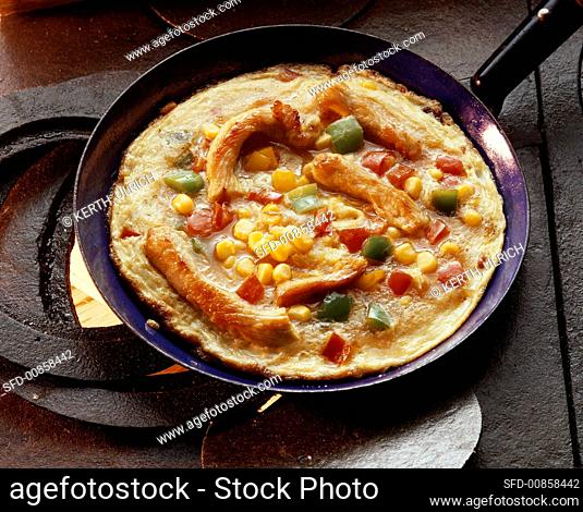 Frittata with vegetables and strips of turkey