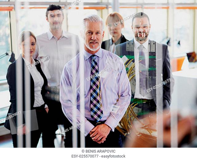 Double exposure design. Senior businessman with his team at office. business people group