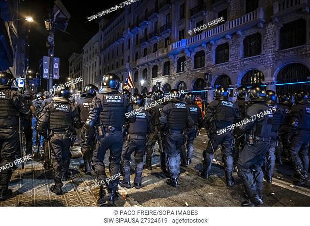 Police officers confront protesters during the demonstration. Thousands of pro-independence protesters from Catalonia have gathered in front of the national...