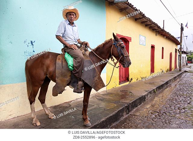 horseman. colonial street. suchitoto. el salvador
