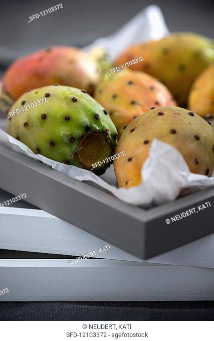 Fresh prickly pears in a box (Italy)