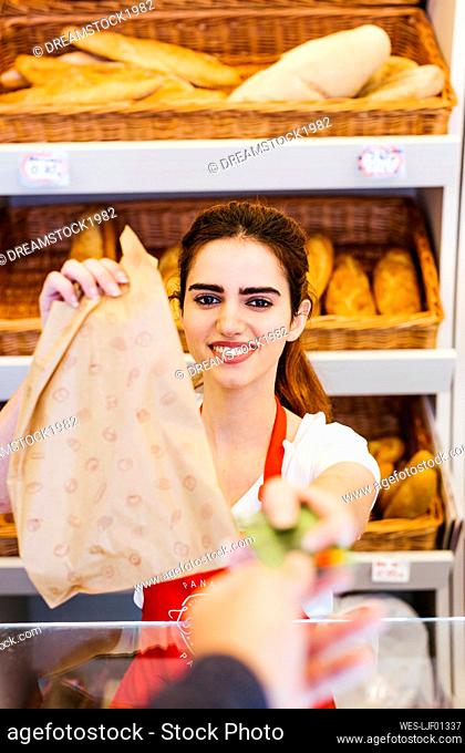 Customer paying with credit card in a bakery