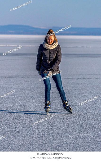 Young girl skating on Lake Balaton in Hungary