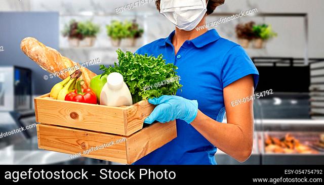 delivery woman in face mask with food in box