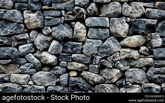 A stone wall made of rocks and gravel