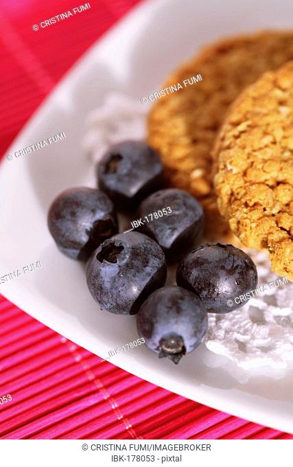 Healthy snack with blueberries and full corn biscuits - close up