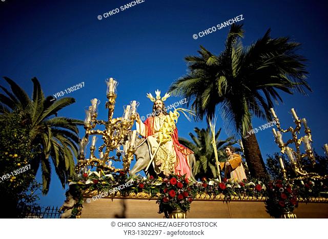 A sculpture of Jesus riding a donkey is carried during a religious procession during the palm sunday in the town of Prado del Rey in southern Spain's Cadiz...